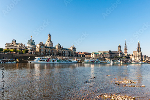 Germany, Saxony, Dresden, Elbe river with moored tourboats and Dresden Academy of Fine Arts in background photo