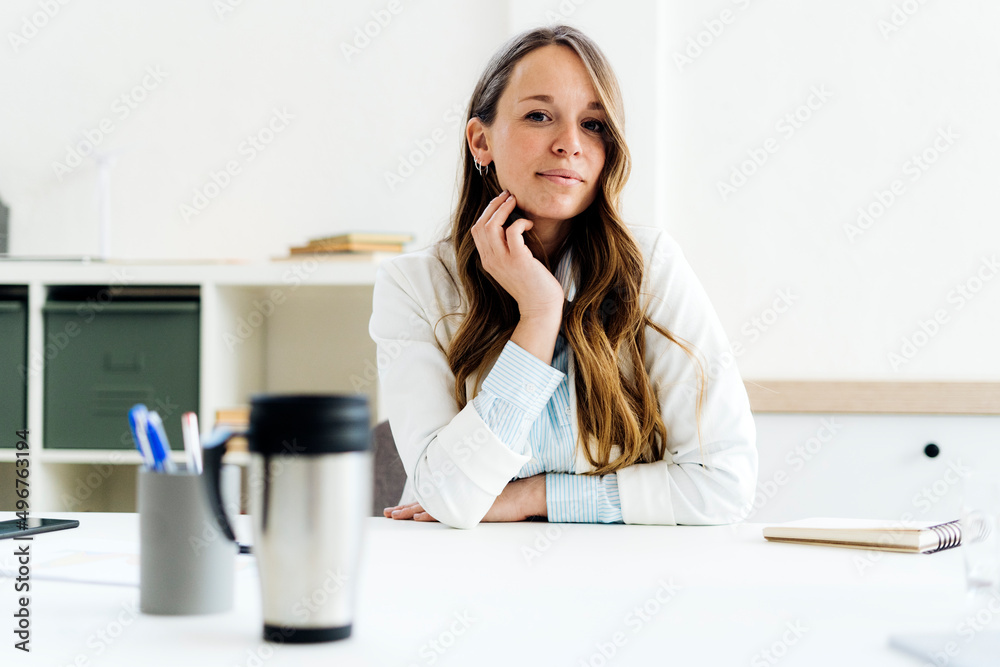 Businesswoman sitting at desk in office