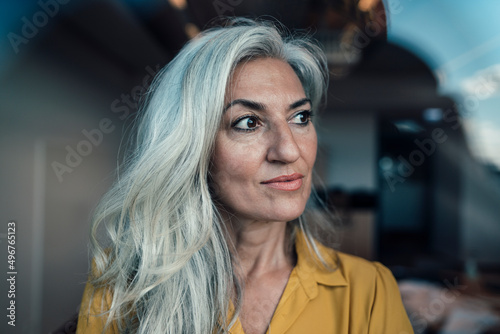 Businesswoman with gray hair at work place photo