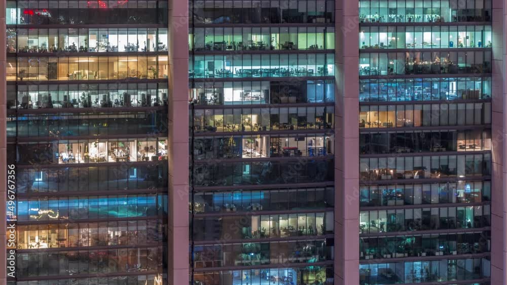 Big glowing windows in modern office and residential buildings day to night timelapse Big glowing windows in modern office and residential buildings day to night timelapse