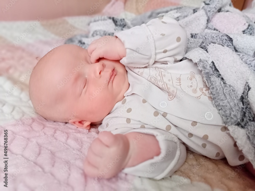 a newborn baby sleeps, a tiny baby who is a few days old. a newborn baby sleeps, a tiny baby who is a few days old.