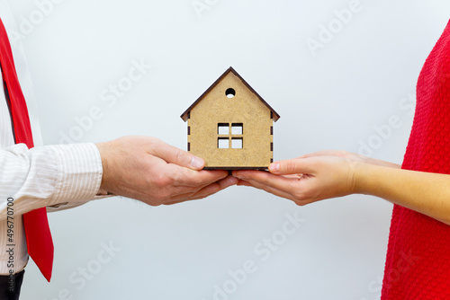 Couple sharing a miniature house model