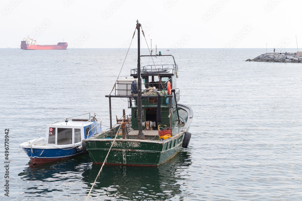 Fishing boats are anchored in Avcilar port, district of Istanbul