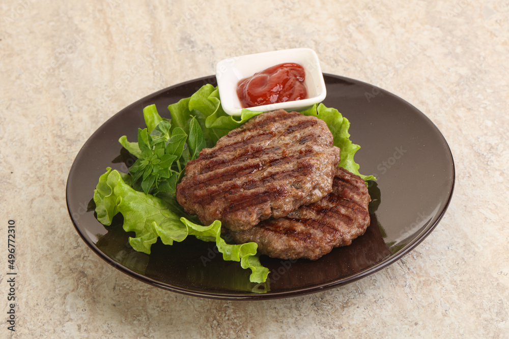 Grilled beef burger cutlet with sauce Grilled beef burger cutlet with sauce