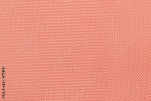 Texture of red plastic with a pattern. Decorative red plastic with a pattern. 
