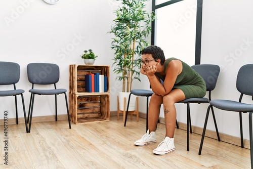 Young hispanic woman desperate sitting on chair at waiting room © Krakenimages.com