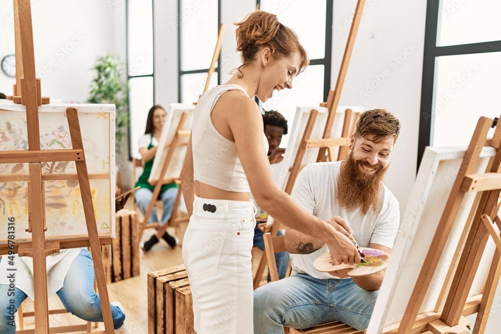 Group of people smiling happy drawing at art studio.