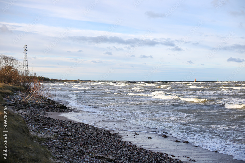Baltic sea shoreside view with waves and cloudy weather. Baltic sea shoreside view with waves and cloudy weather.