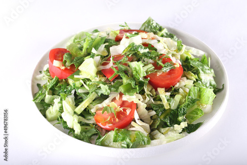 spring salad with herbs, cucumbers and tomatoes. Proper nutrition. Healthy lifestyle.