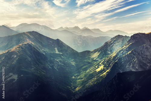 Green valley in high mountains at sunset. Tatra mountains