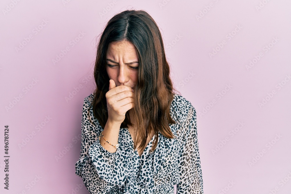 Young brunette woman wearing elegant animal print shirt feeling unwell and coughing as symptom for cold or bronchitis. health care concept. Young brunette woman wearing elegant animal print shirt feeling unwell and coughing as symptom for cold or bronchitis. health care concept.