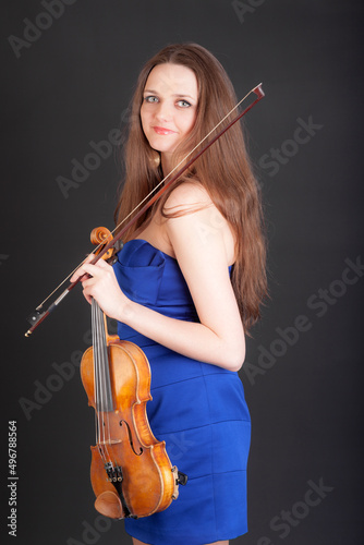 girl in a blue dress with a violin