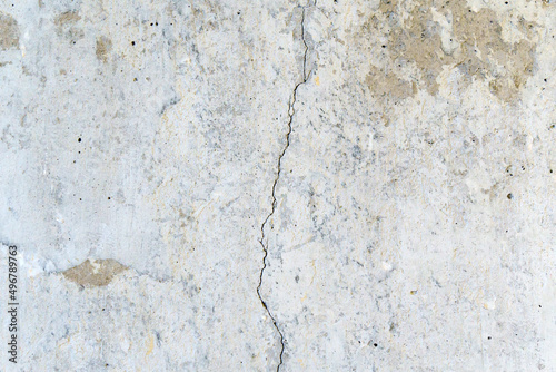Crack on concrete wall texture, background, selective focus