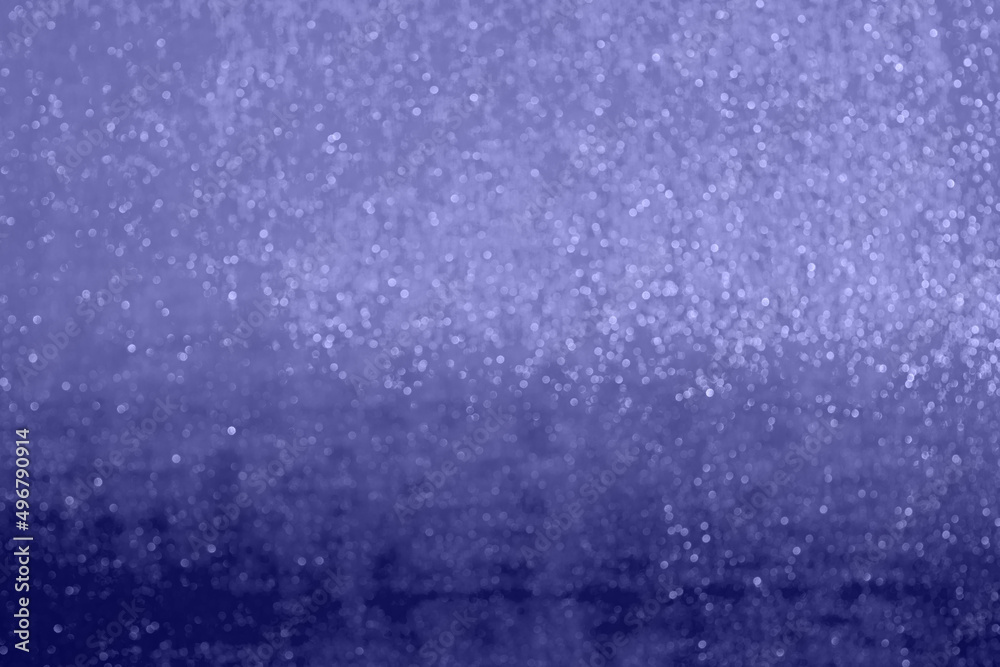 Surface of wrapping film with bokeh and gradient toned in very peri Surface of wrapping film with bokeh and gradient toned in very peri