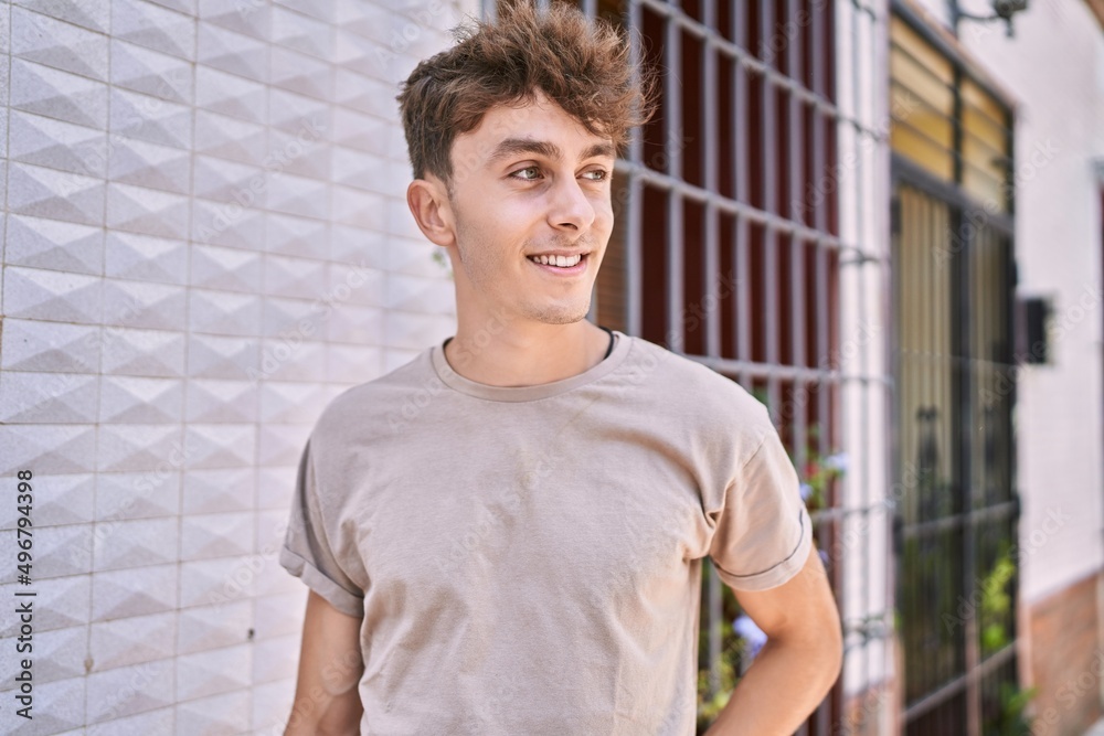 Fototapeta premium Young caucasian man smiling happy standing at the city.