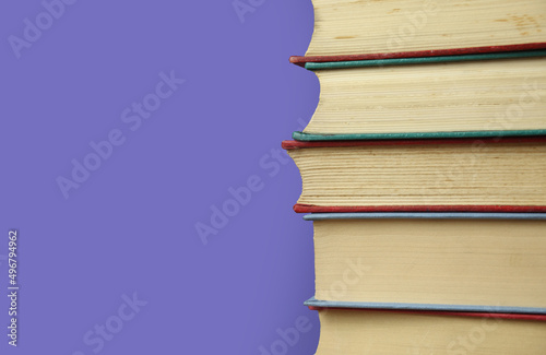 Book collection on purple background