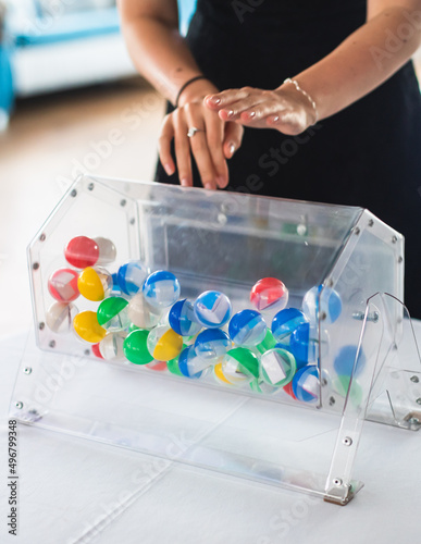Fotografie Process of prize drawings, extracting a winning numbers of lottery machine, raff