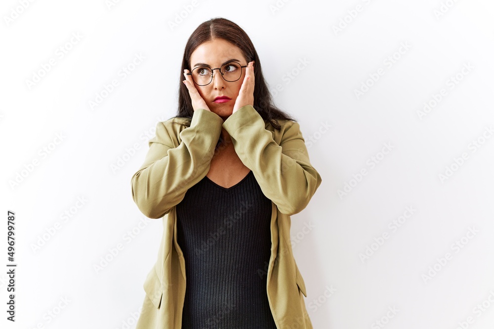 Young brunette woman standing over isolated background tired hands covering face, depression and sadness, upset and irritated for problem Young brunette woman standing over isolated background tired hands covering face, depression and sadness, upset and irritated for problem