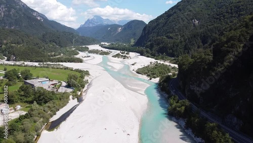 Tagliamento River at Tolmezzo, Udine, Italian Alps, Italy - Aerial Drone View of the Riverbed and Streaming Blue Gletsjer Water photo