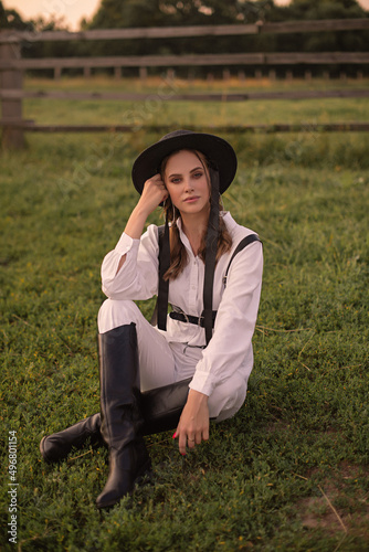 portrait of a woman in a cowboy hat on ferm photo