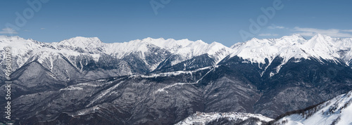 Panoramic view of snowy Caucasus mountains in Krasnaya Polyana ski resort © lilkin