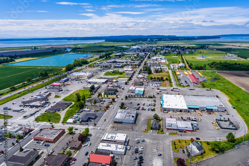 Aerial view of the cityscape of Stanwood with a view of Camano Island in the distance, Washington photo