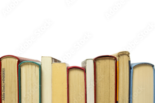 Few old books sorted on white background isolated