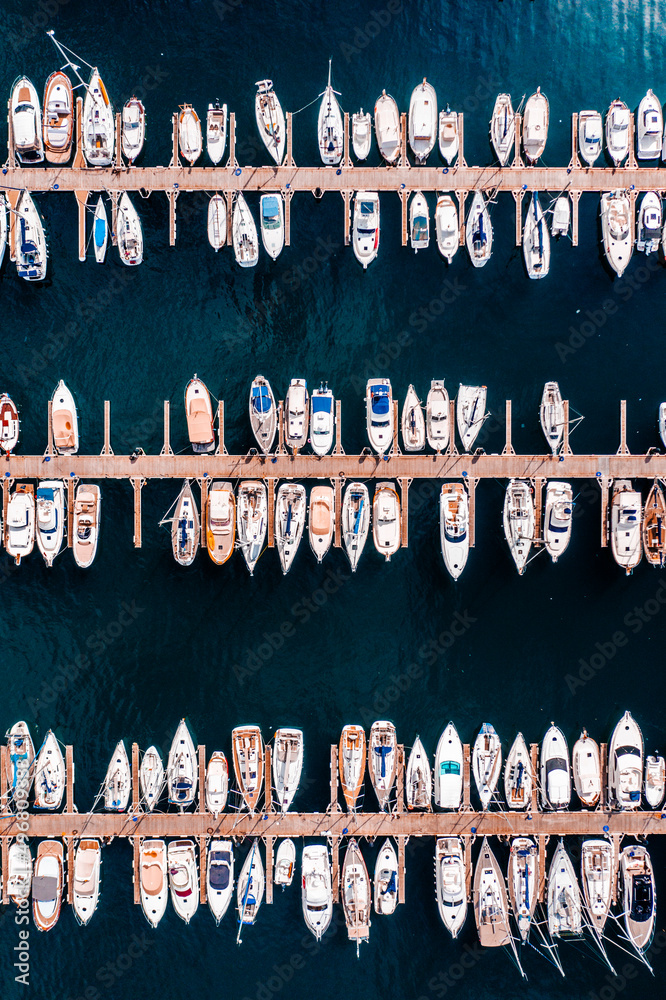 Aerial view of motorboats docked at Sant Feliu de Guixols harbour, Girona, Spain. Aerial view of motorboats docked at Sant Feliu de Guixols harbour, Girona, Spain.