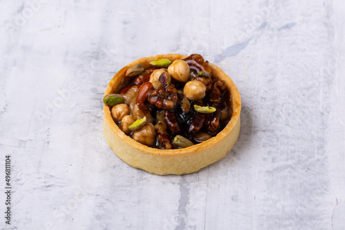 Delicious tartlet filled with nuts photo