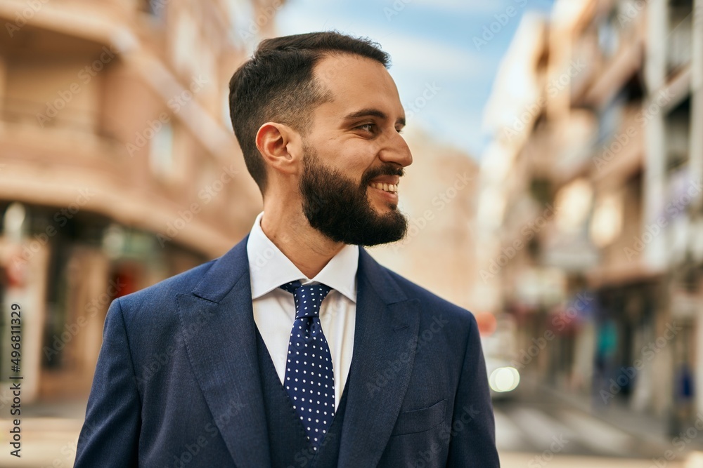 Young businessman smiling happy standing at the city. Young businessman smiling happy standing at the city.