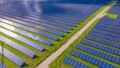 Drone aerial view of a photovoltaic solar system. Alternative energy, go green background.