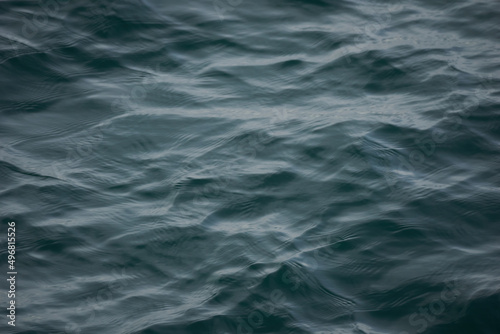 Beautiful shot of gray real sea water ripple in the sea photo