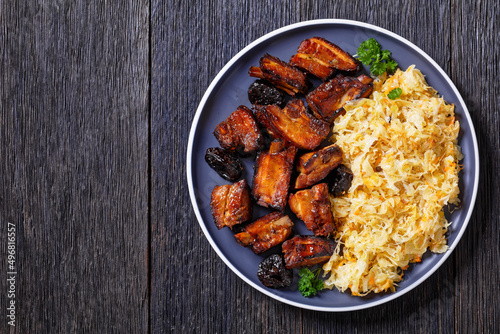 braised sauerkraut with pork and prunes on plate