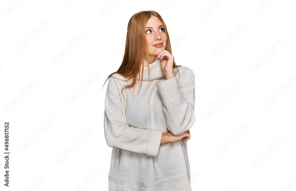 Young irish woman wearing casual winter sweater with hand on chin thinking about question, pensive expression. smiling and thoughtful face. doubt concept. Young irish woman wearing casual winter sweater with hand on chin thinking about question, pensive expression. smiling and thoughtful face. doubt concept.