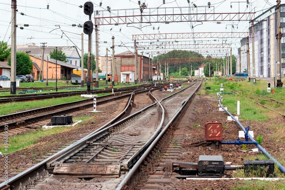 Naklejka premium Railway tracks near high-rise buildings of the railway station