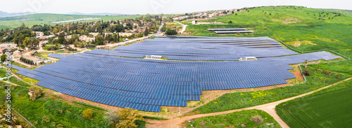 Aerial view of solar panels on a hill side, Beit HaShita, Israel. photo