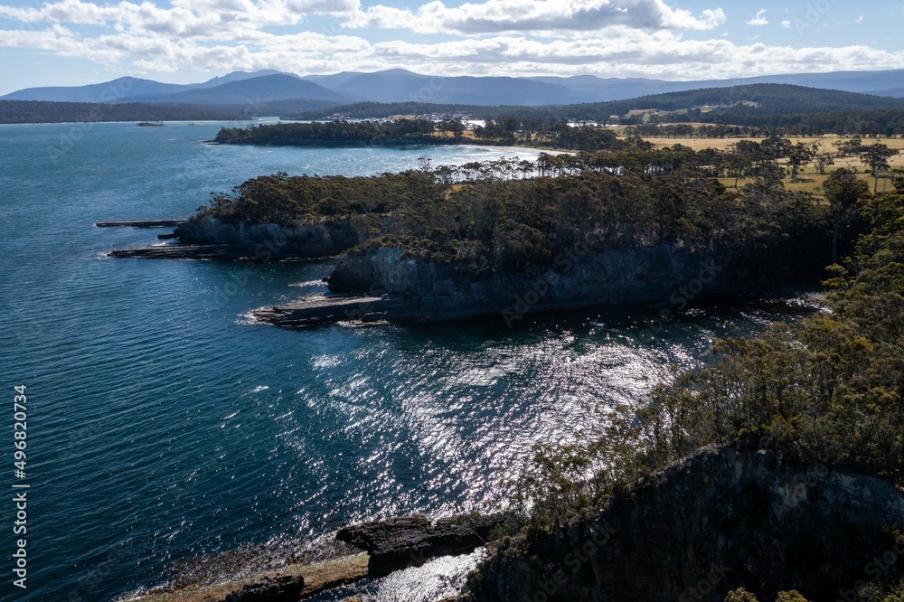 tasmanian coastal landscape in australia. aerial photos of rocky ocean views in southern tasmania. showing towns and farms.