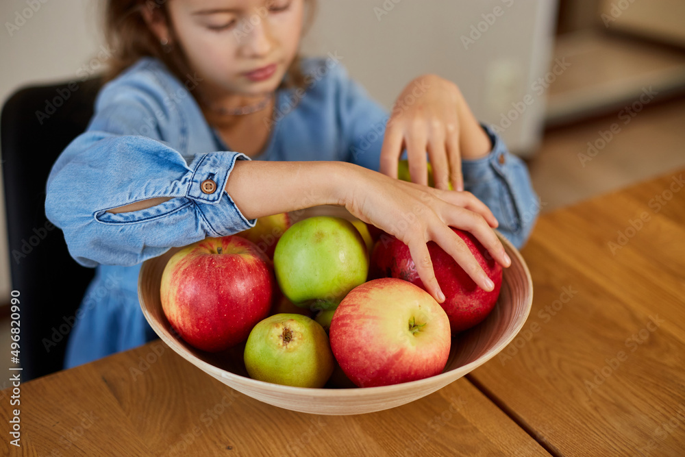 custom made wallpaper toronto digitalLittle happy girl hold bowl with fruits in the kitchen at home, healthy child snack