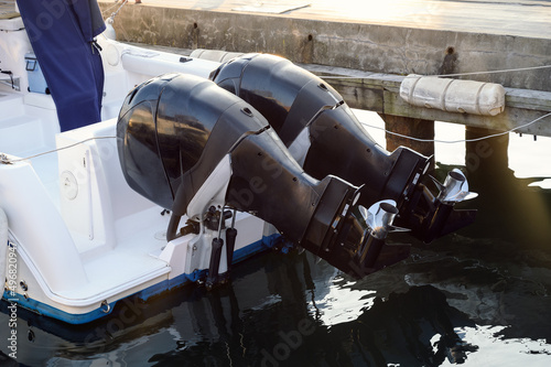 Two outboard boat motor. Selective focus. photo