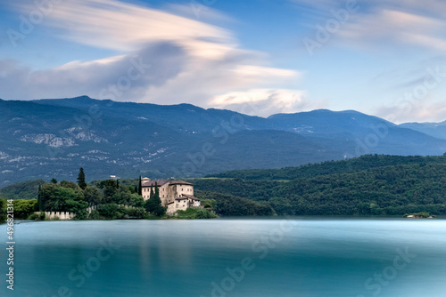 The medieval Stenico castle in the middle of the lake Toblino. Madruzzo, Trentino, Italy.