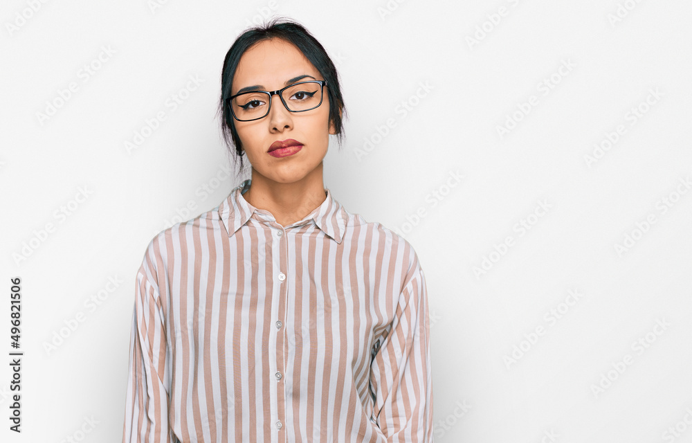 Young hispanic girl wearing casual clothes and glasses looking sleepy and tired, exhausted for fatigue and hangover, lazy eyes in the morning. Young hispanic girl wearing casual clothes and glasses looking sleepy and tired, exhausted for fatigue and hangover, lazy eyes in the morning.