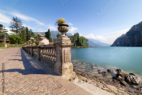 Balustrade of the lakeside promenade of the town of Riva del Garda. Trentino, Italy.