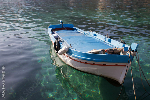 evocative image of fishing boats moored in the harbor in a small fishing village in Sicily, Italy  © massimo