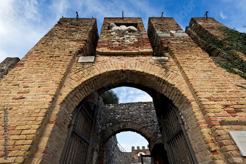 Portal in the crenellated walls of the Rocca (fortress) di Lonato. Lonato del Garda, Brescia province, Lombardy, Italy, Europe. photo