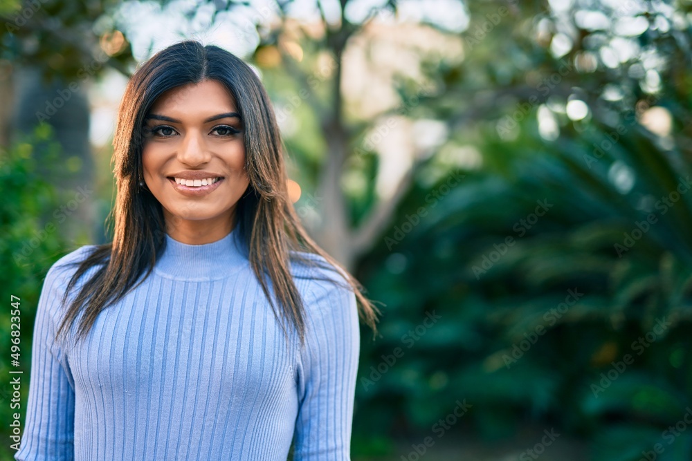 Beautiful hispanic woman smiling confient at the park Beautiful hispanic woman smiling confient at the park