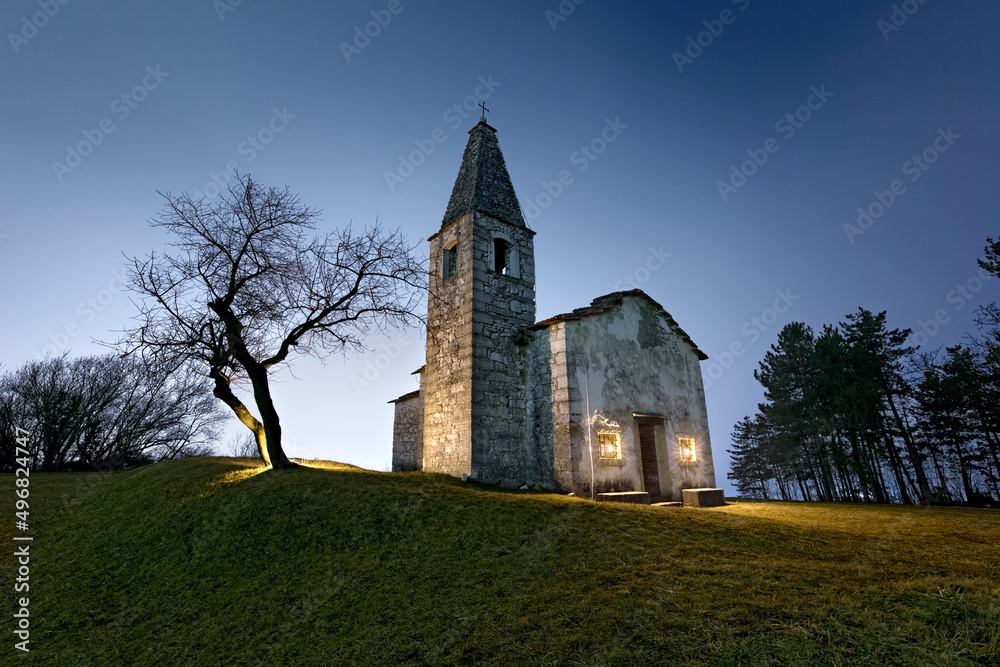 Night at the medieval church of Santa Apollonia in Manzano. Gresta Valley, Trento province, Trentino Alto-Adige, Italy, Europe.