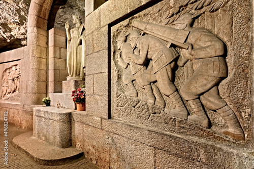 Doss Trento: the underground chapel of Santa Barbara, patron of miners, with the sculptures of the Alpini military units. Trento, Trentino Alto-Adige, Italy, Europe. 