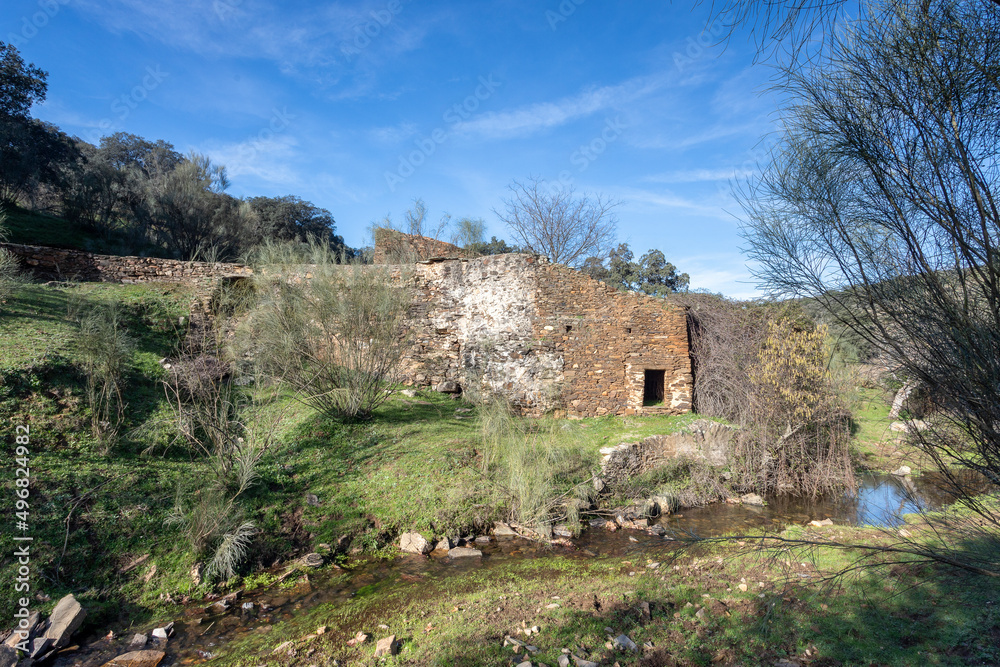 Old abandoned mill in extremadura meadow