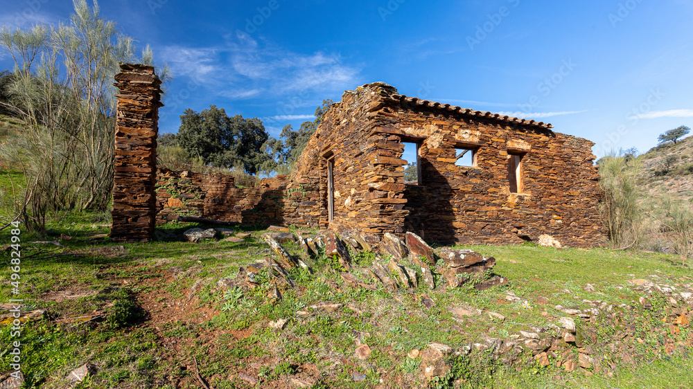 Old abandoned mill in extremadura meadow