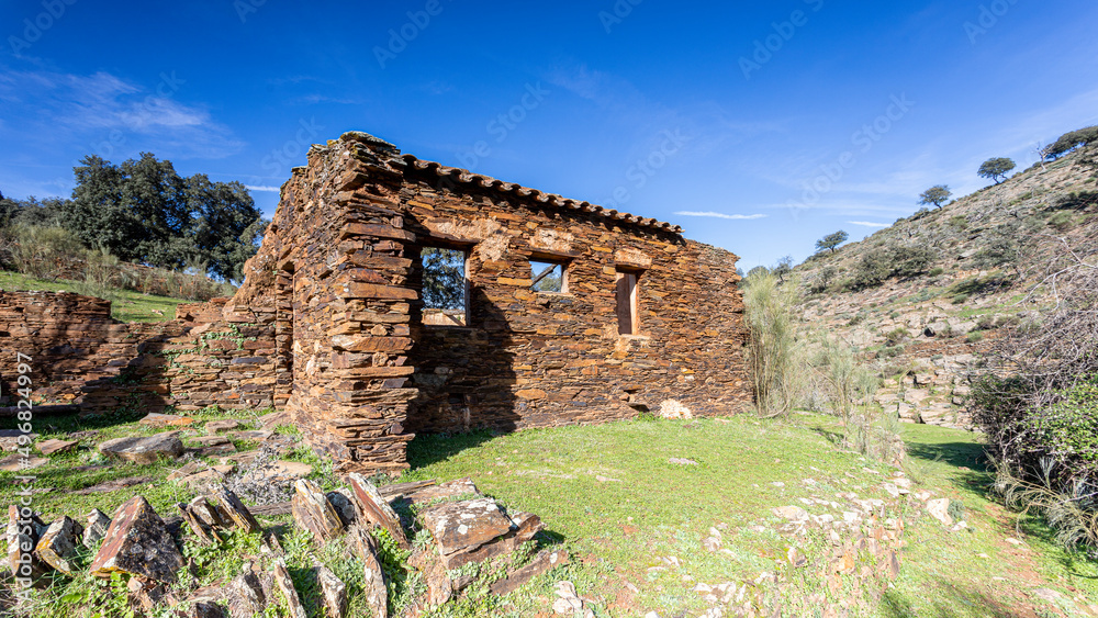 Old abandoned mill in extremadura meadow